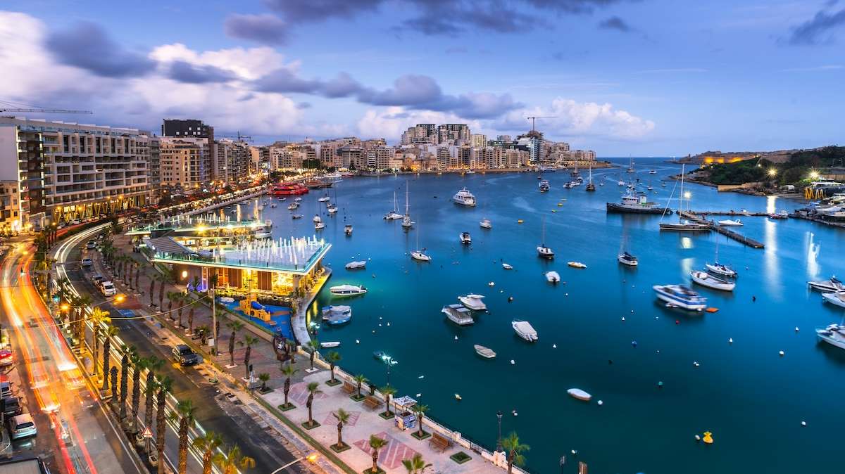 Evening at Sliema Bay promenade in Malta. Illuminated cityscape